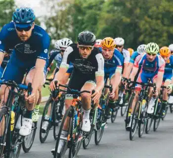 group of cyclist on asphalt road