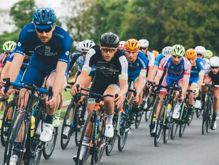 group of cyclist on asphalt road